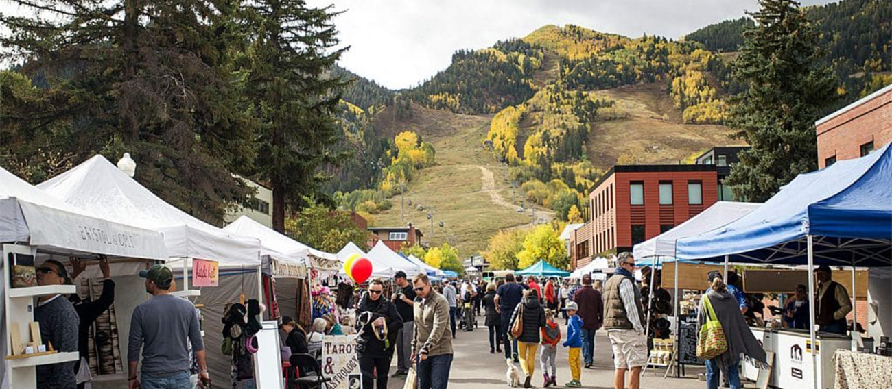 Busy Saturday market in small town with customers