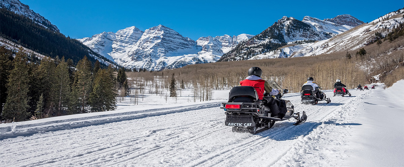 Snowmobile Snowmobiling towards Maroon Bells in Aspen, Colorado