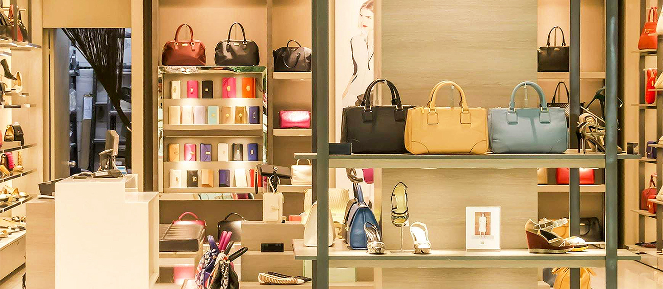 Shopping bags on display in store front 