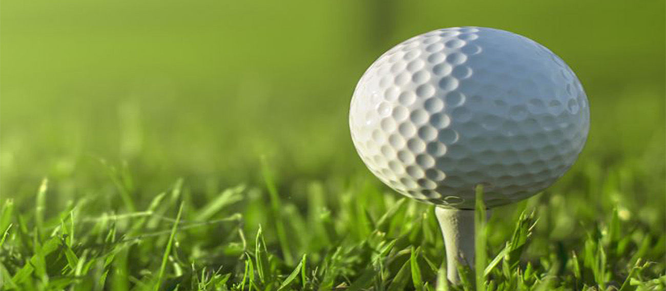 Golfball on top of tee on tee-box