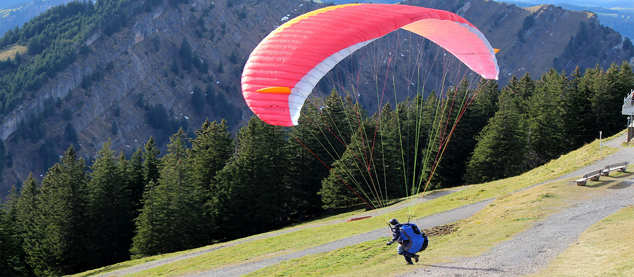 Man launching off takeoff from the top of Aspen Mountain in Aspen, Mountain