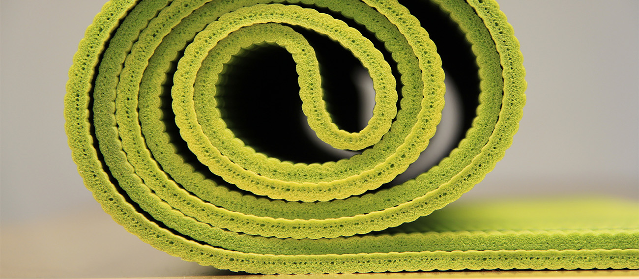 Rolled up Yoga mat in Yoga studio