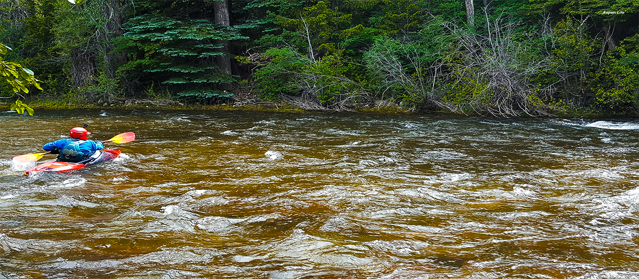 Man kayaking down the Rio Grande River in Aspen, Colorado in July 2024